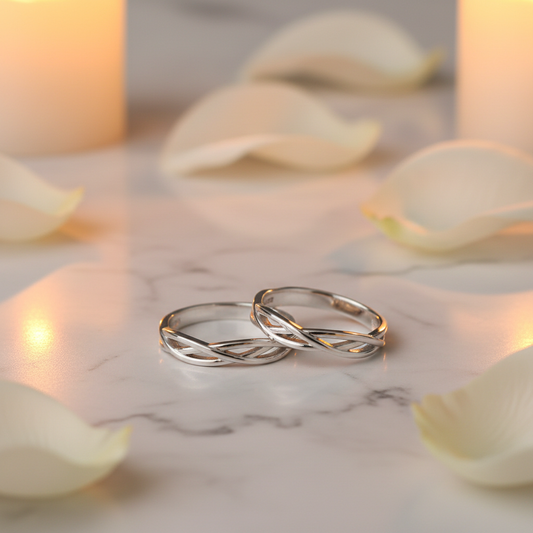 Luxury wedding couple rings on marble with rose petals